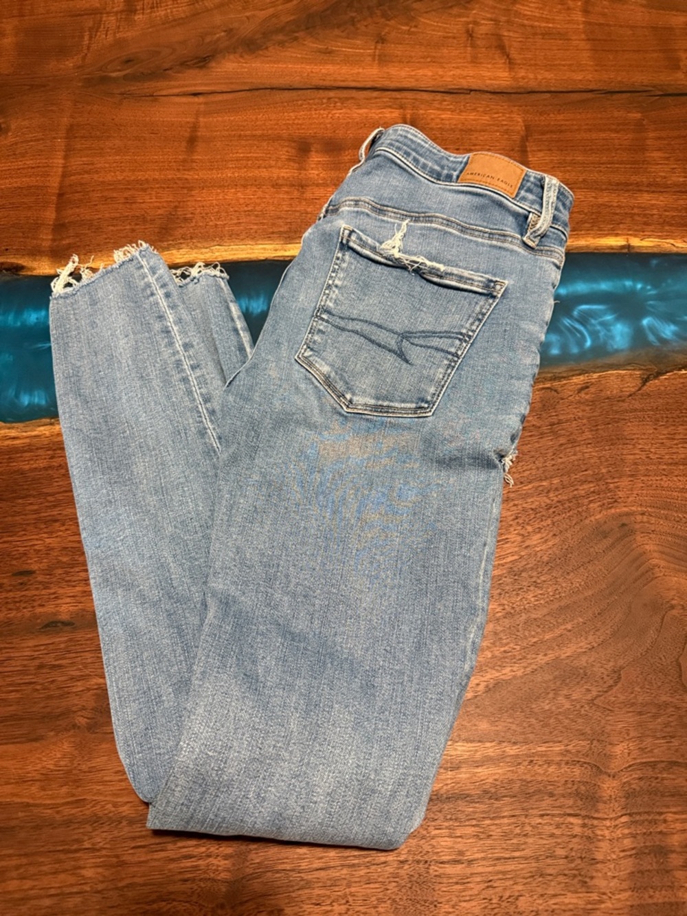 American Eagle Outfitters Light Blue Skinny Jeans with Frayed Hem